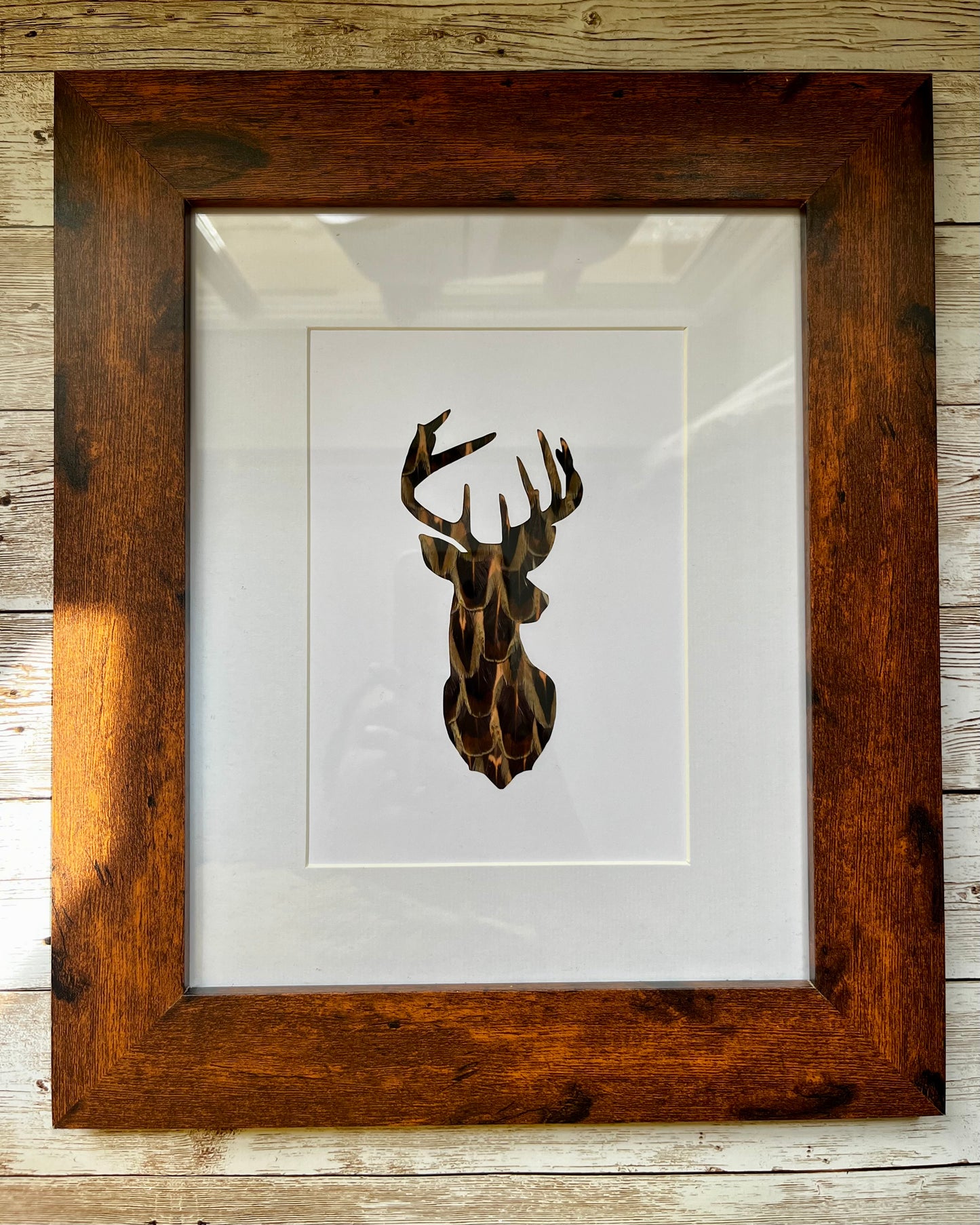 “The Stag" Backed With Pheasant Feathers