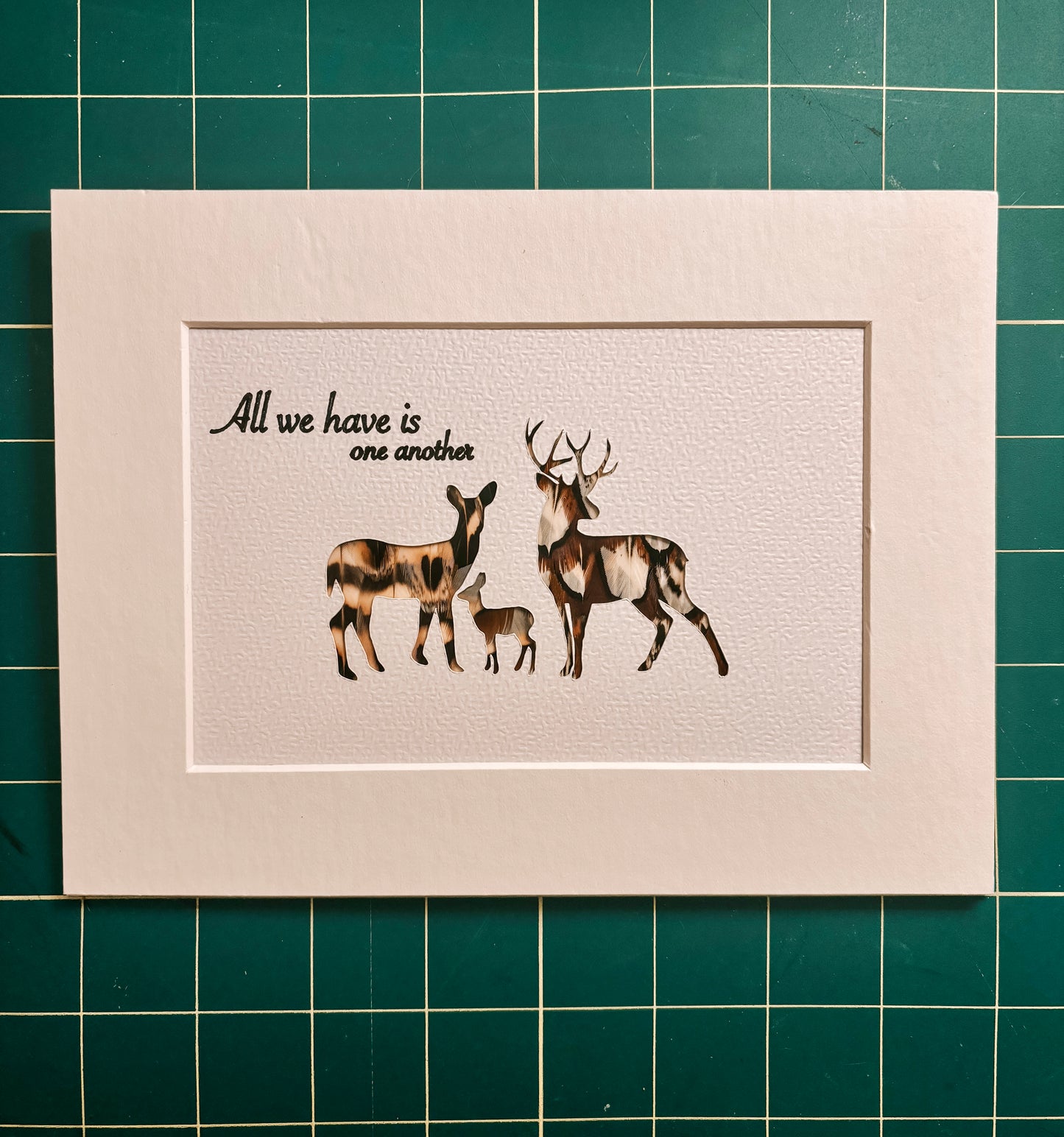 "All we have is one another" Backed With Game Bird Feathers